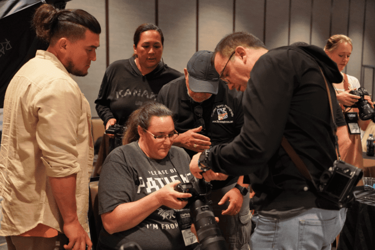 Photographers helping one another at GotPhoto Summer Camp