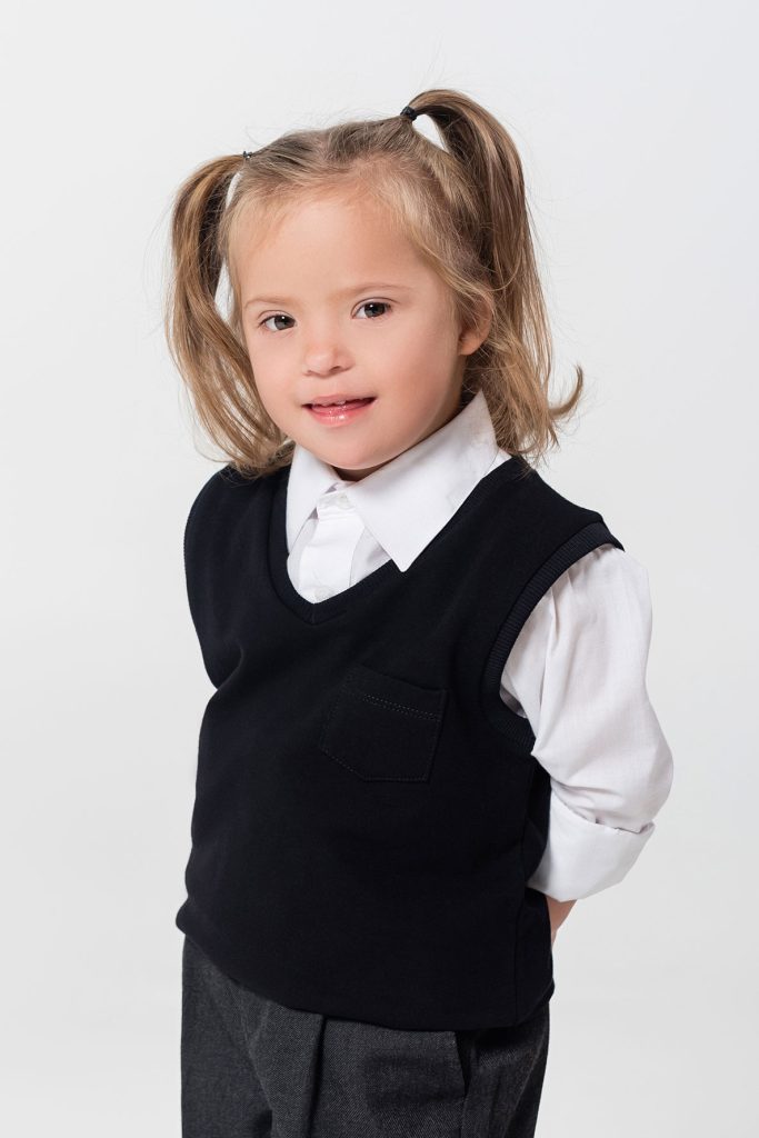 girl with down syndrome posing for her nursery portrait