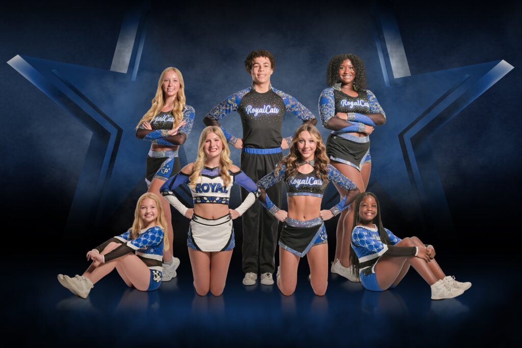 A cheerleading squad poses and showcases symmetry in their posing